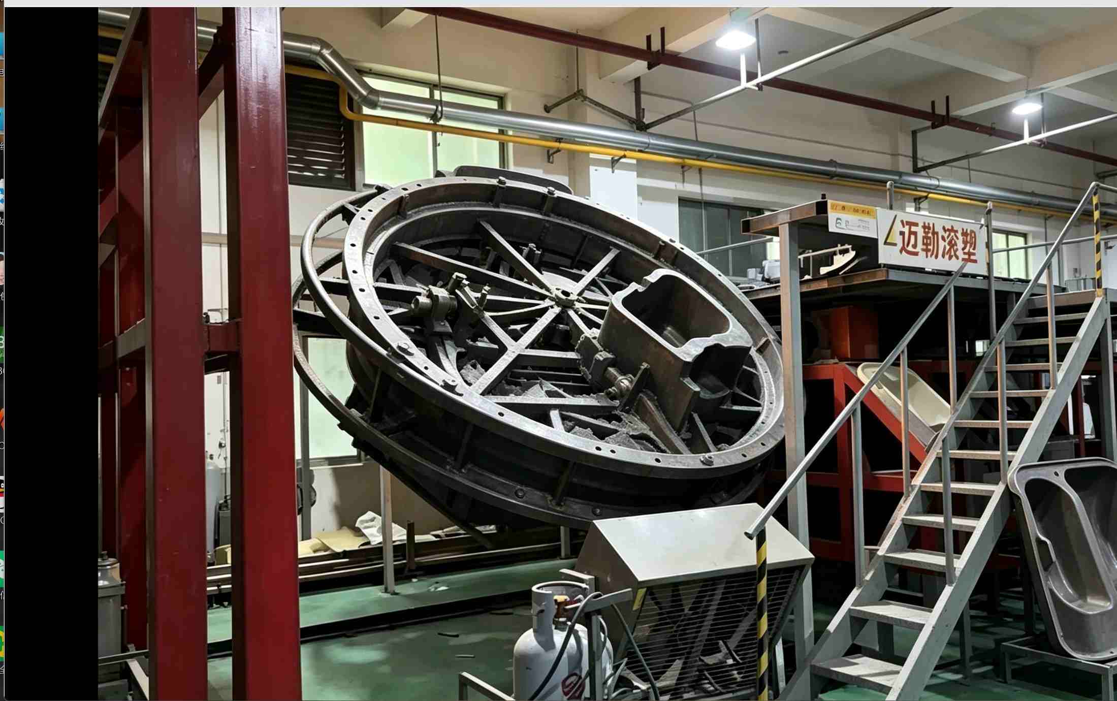 Biaxial rotating rotomolding machine at Mellow factory Mellow steel mold rotomolding machine