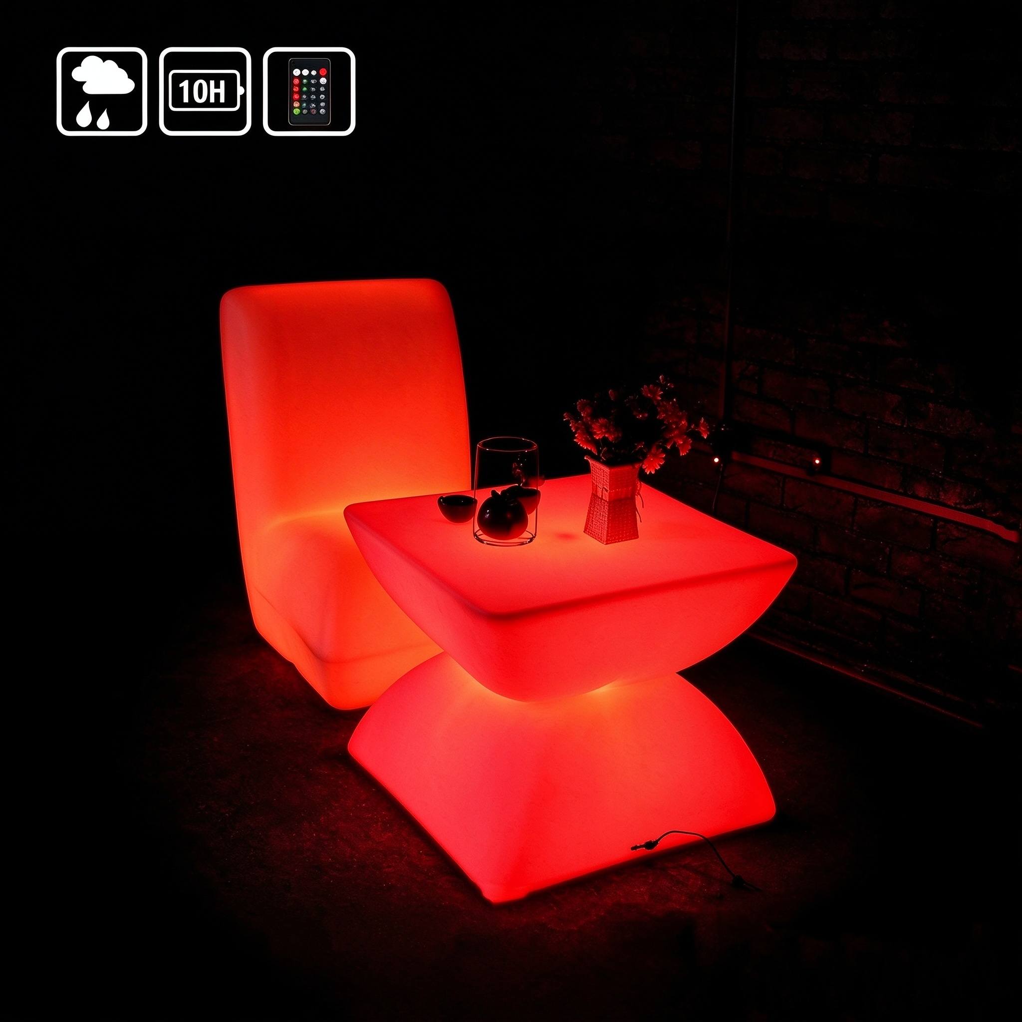 Red LED rotomolded lounge chair with a matching glowing side table, ideal for bars and outdoor events.